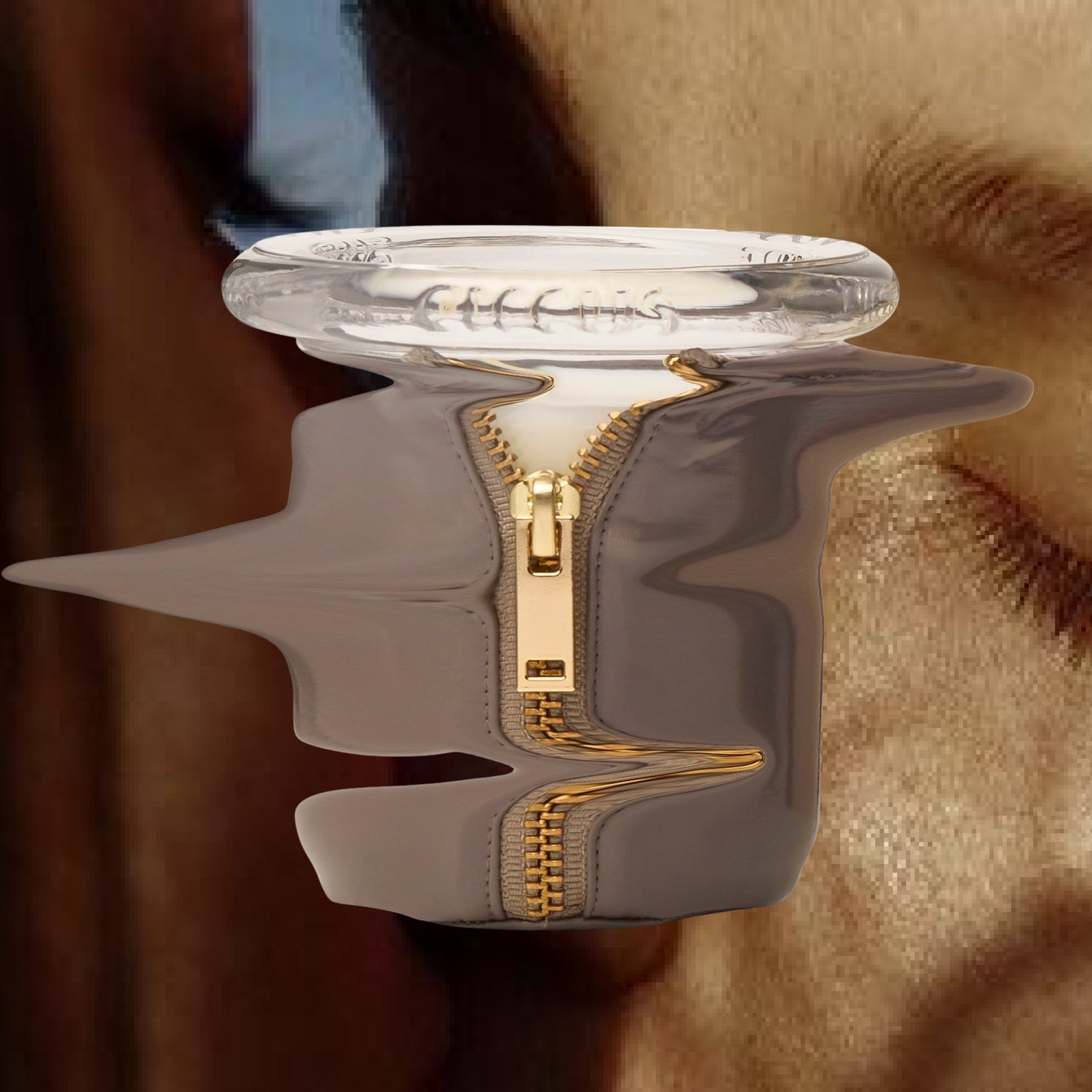 Circus Bound candle in gray latex with gold zipper, warped against a close-up of skin and hair — surreal, sensual artwork tied to The Sounds of Bound playlist.