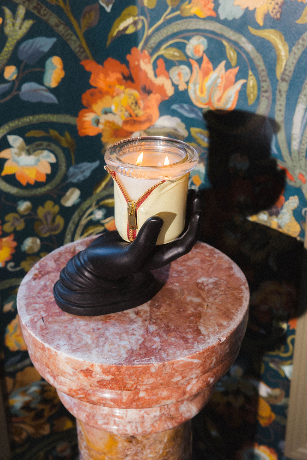 Interior Designer Benjamin Stelly's Austin studio with bound in onyx and butter vinyl wrap styled on wood bookshelf