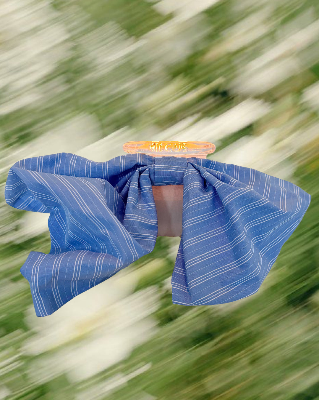 blue striped fabric bow on circus brand candle 