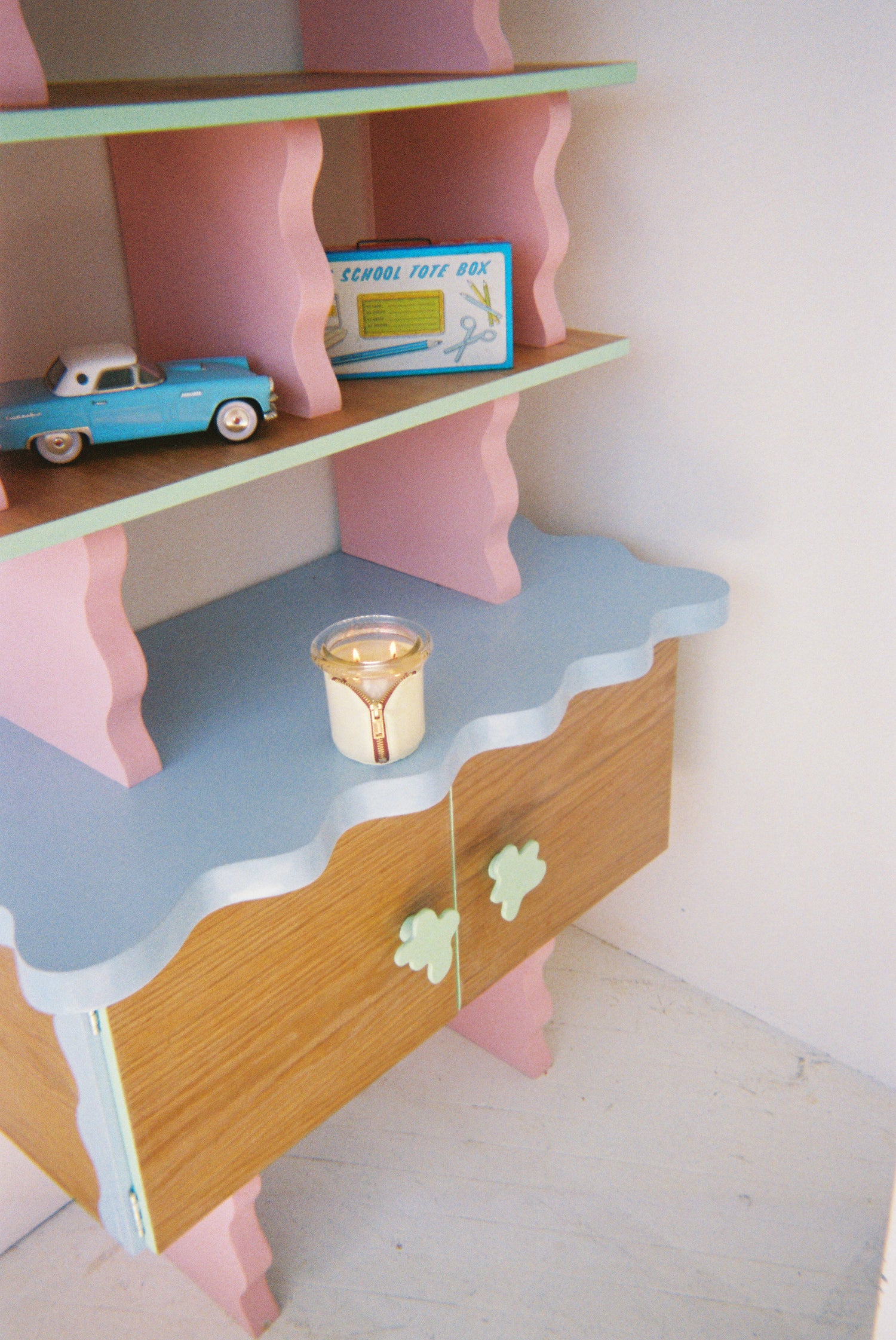 memphis etagere by sophie colle and circus bound candle in butter and onyx