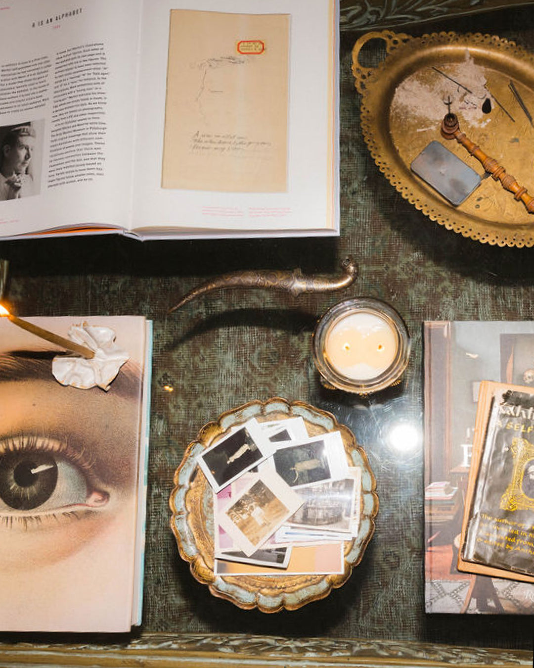 Art Director Colson Horton's coffee table with Bound gray candle styled with books