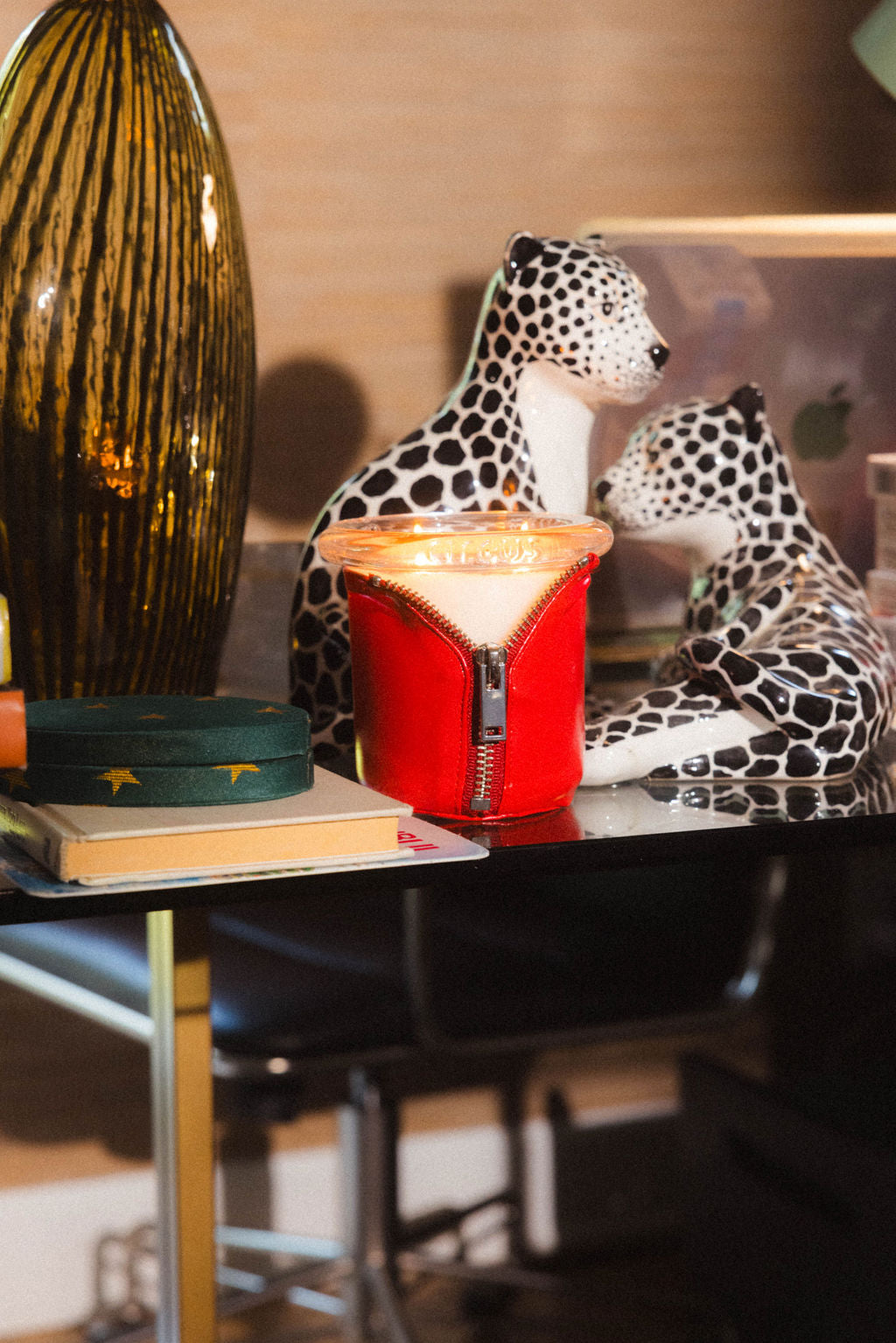 Art Director Colson Horton's office with Bound red candle styled on glass desk 