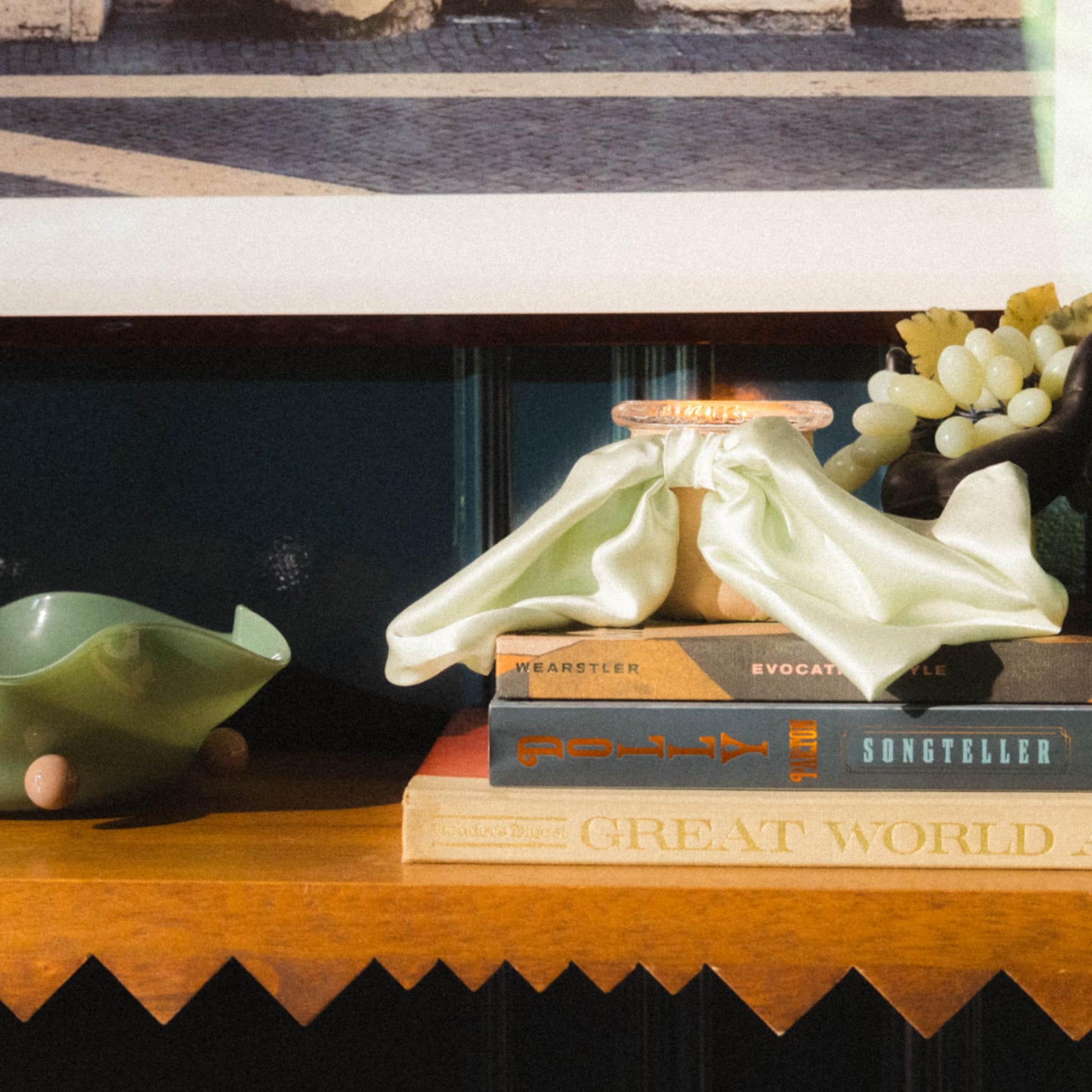 Art Director Colson Horton's entry table styled with Bow Baby mint and khaki luxury scented candle