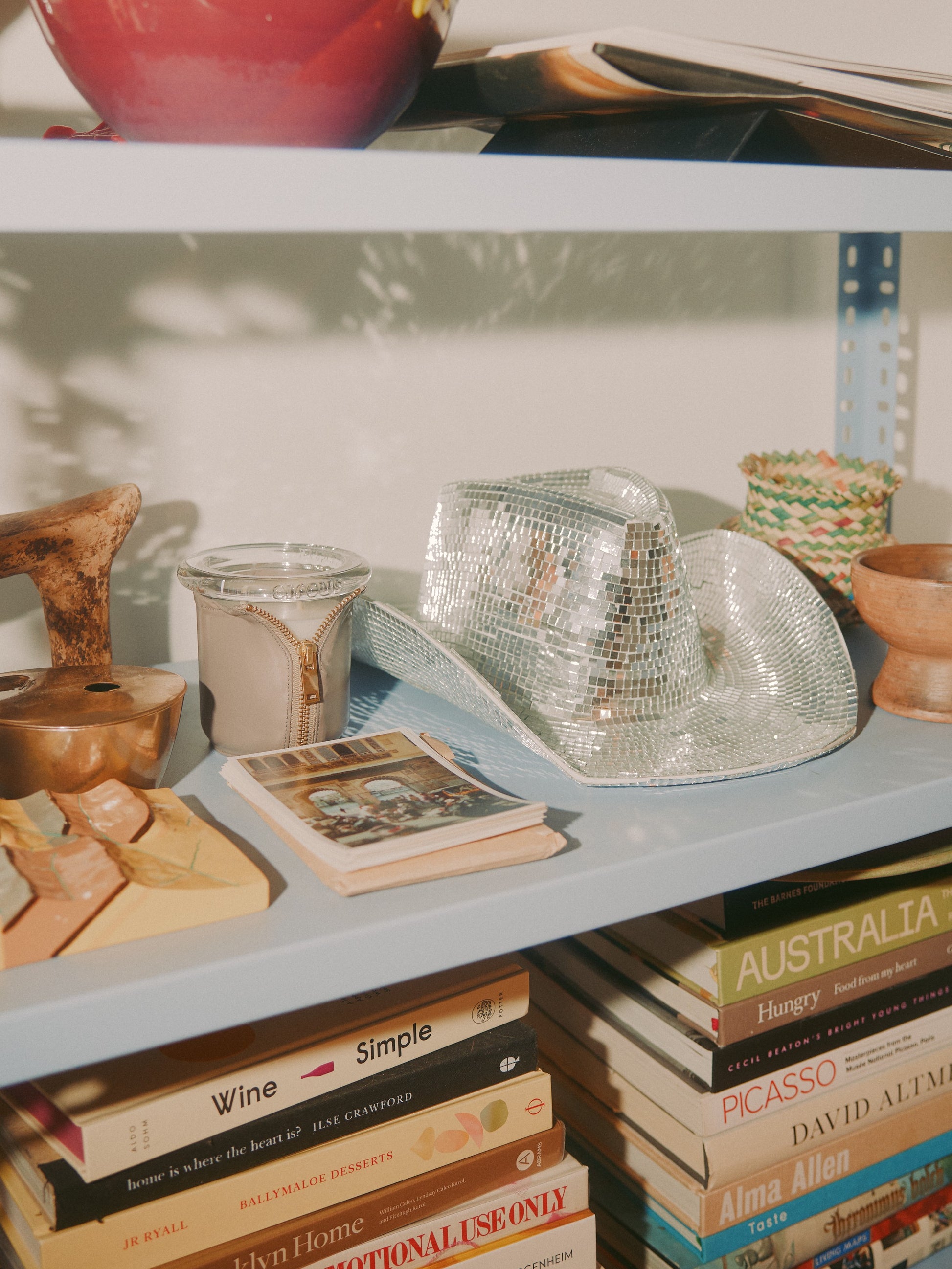Decorator Conor Burke's NYC studio with Bound gray candle styled with crystal cowboy hat