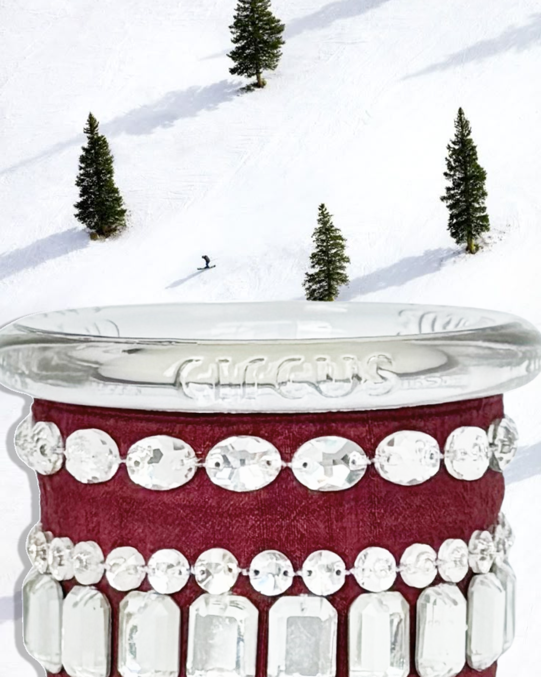 crystal fetish in burgundy against a snowy mountain background