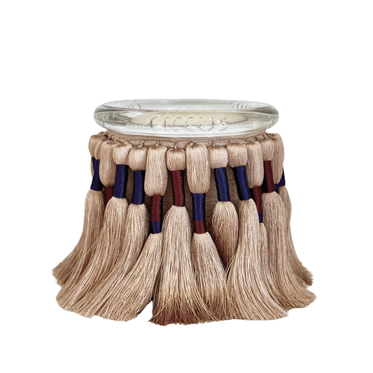 fuzzed candle featuring silk tassels and a warm and soft scent