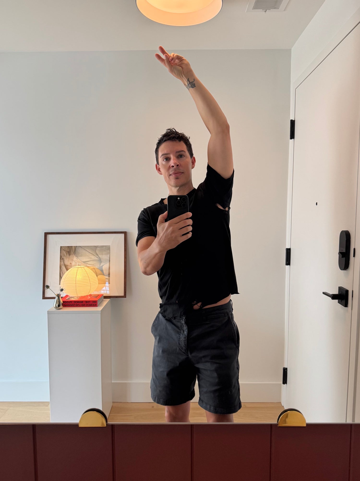 circus founder lee lenox shows off his favorite tattered tshrit 