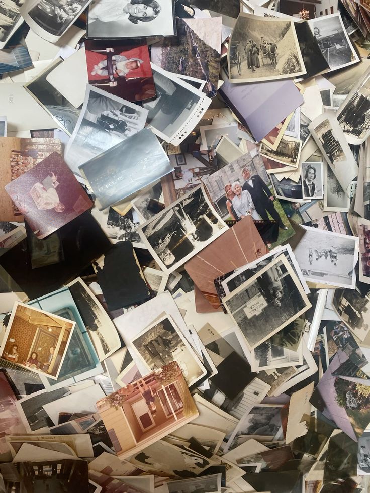 Collection of old photographs on a surface burning thoughts by circus candles